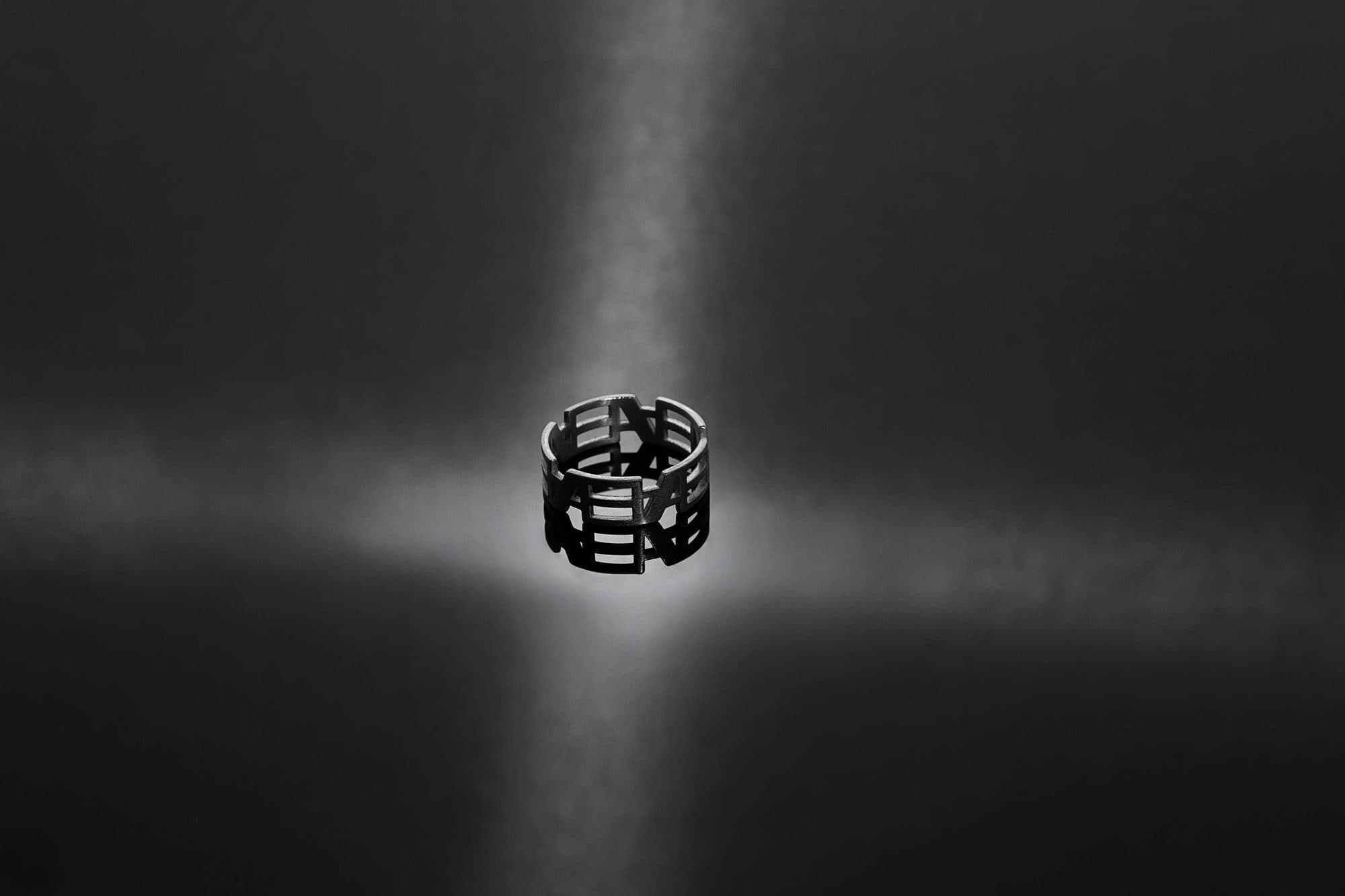 Inverted Monogram ring caught in a single beam of light